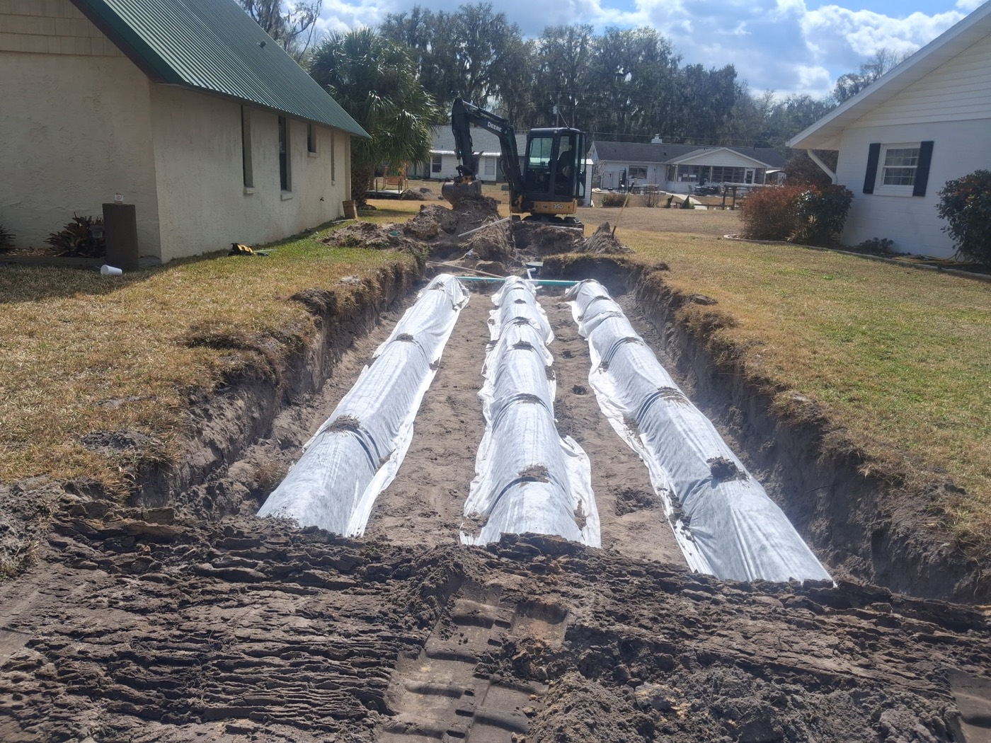 Alpha Environmental crew installing a leaching-chamber drain field on a Central Florida property